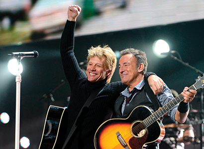 121212 concert photo of Bon Jovi and Bruce Springsteen by Kevin Mazur/Getty Images