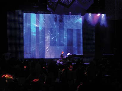 John Legend performed at the Aria resort’s MJCI VIP party, animated by layers of PixelFLEX LED curtain.