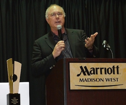 Foster speaking at the 2013 Wisconsin Entrepreneurs’ Conference after receiving the Ken Hendricks Memorial Seize the Day Award