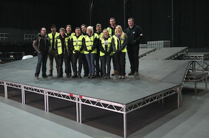 Students build a stage for Kanye West at Backstage Academy.