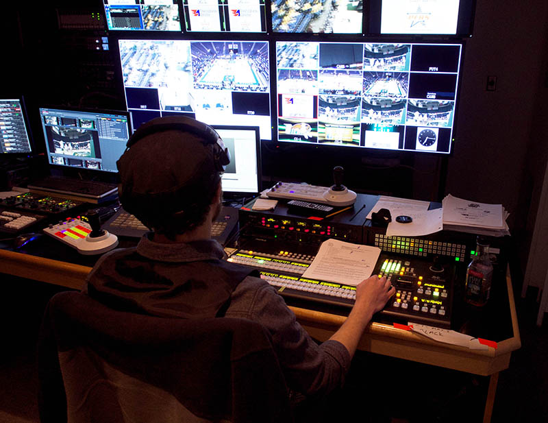 Myriad Productions operator Bo Smith uses FOR-A's HVS-390HS video switcher during a college basketball game at Times Union Center.