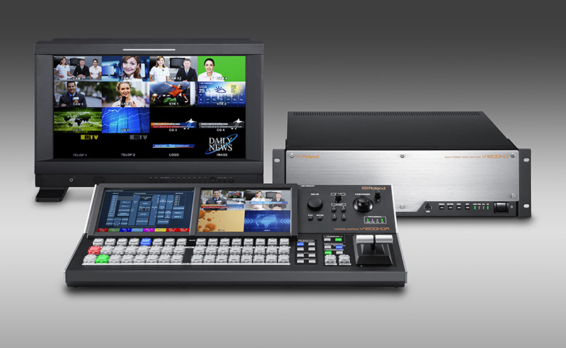 Roland’s new V-1200HD Broadcast and Live Video Production Switcher (right, rear), along with the V-1200HDR Control Surface (foreground) and video monitor.