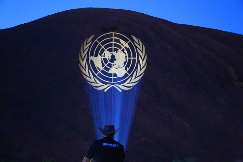 The UN logo projected onto Ayers Rock aka Uluru in central Australia