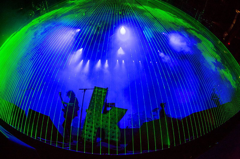 The band played behind a curtain of laser beams from Lightwave International. Photo by Erik Kabic Photography.