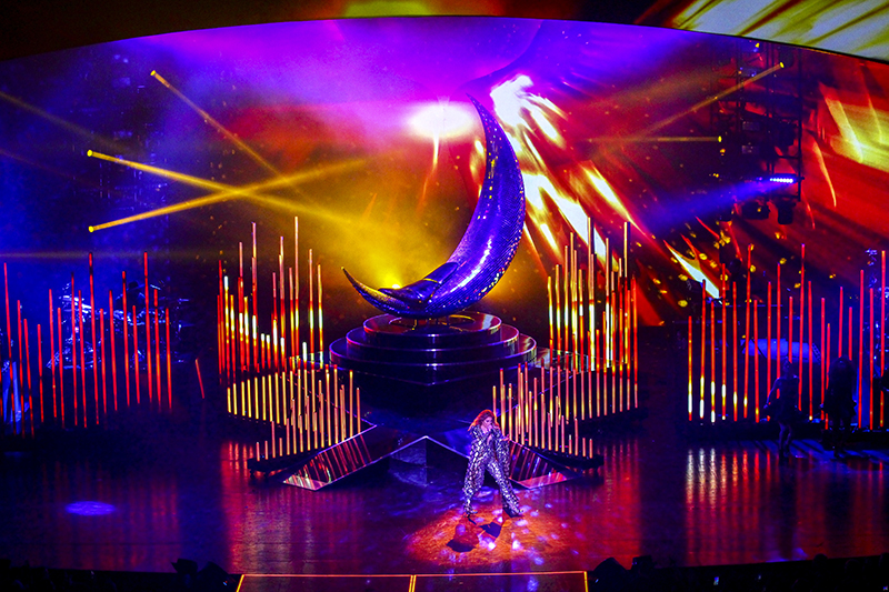 The set design featured a large crescent moon.