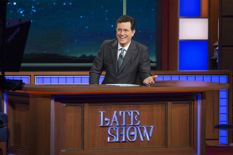 Stephen Colbert at his desk on the set.