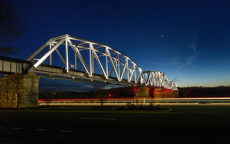 A total of 108 Lumenbeam large color changing 10 degree fixtures were used to light up the bridge, which has stretched across the Cumberland River in Clarksville, TN since 1890. Photo by Joseph Hilliard