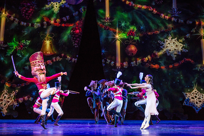 The Nutcracker (Alberto Velazquez) and Marie (Amanda Assucena) dance under the dramatically expanded tree during the battle with the rats. Photo by Cheryl Mann