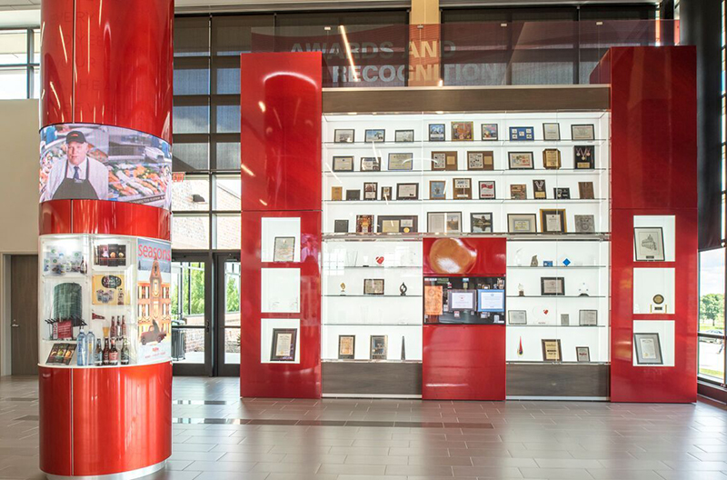 The Dwight Vredenburg History Pavilion within the lobby of Hy-Vee's new Ron Pearson Center makes use of NanoLumens' 360-degree Nixel Series LED displays.