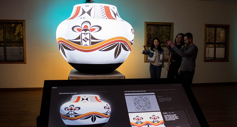 Ideum worked closely with UNM instructor and potter Clarence Cruz and artist Michelle Lowden of Milo Creations to design an experience that allows users to investigate these intricate designs powered by Christie Pandoras Box